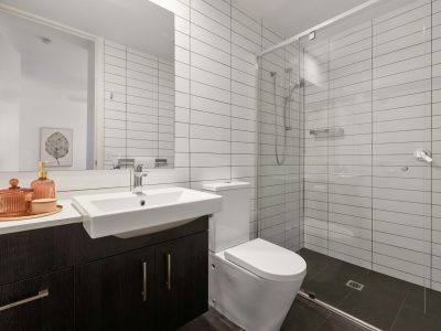 tile-glass-shower-dark-vanity-bathroom-portland.jpg Portland bathroom remodel with tile shower walls, glass divider, and custom dark wood vanity